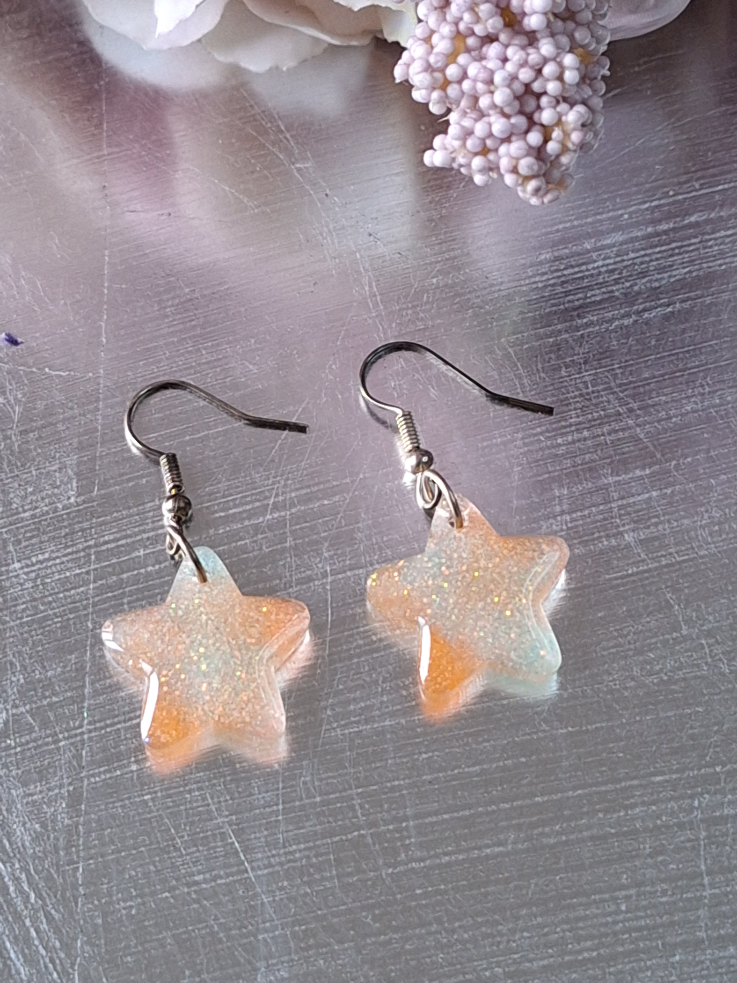 Handmade orange and pale blue star shaped earrings