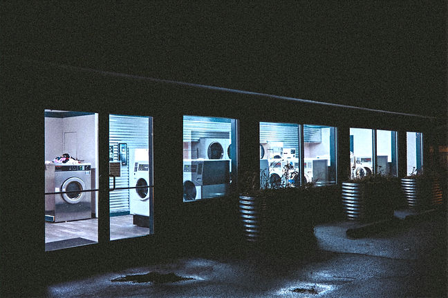 A laundromat sits empty at night._edited.jpg