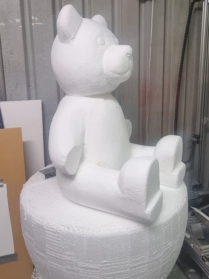 White foam bear sculpture sitting down on a pedestal FOAM&ART.