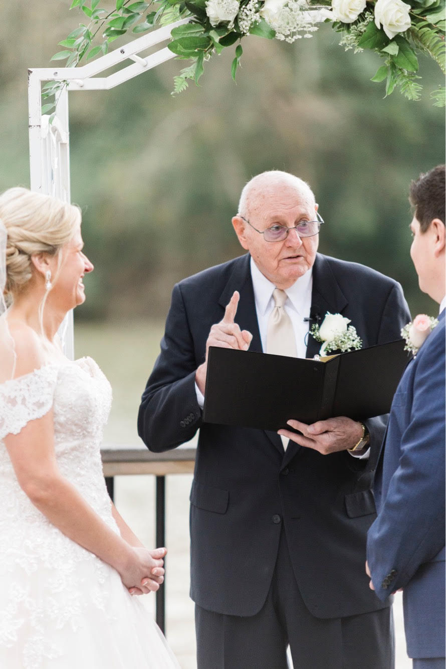 My grandfather coaching while he was officiating my wedding.