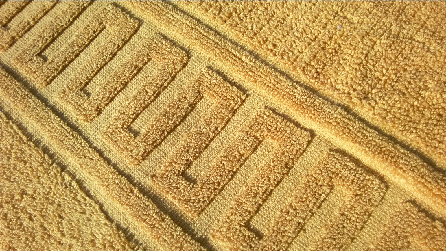 700 gr/m2 uni colour relief towel.