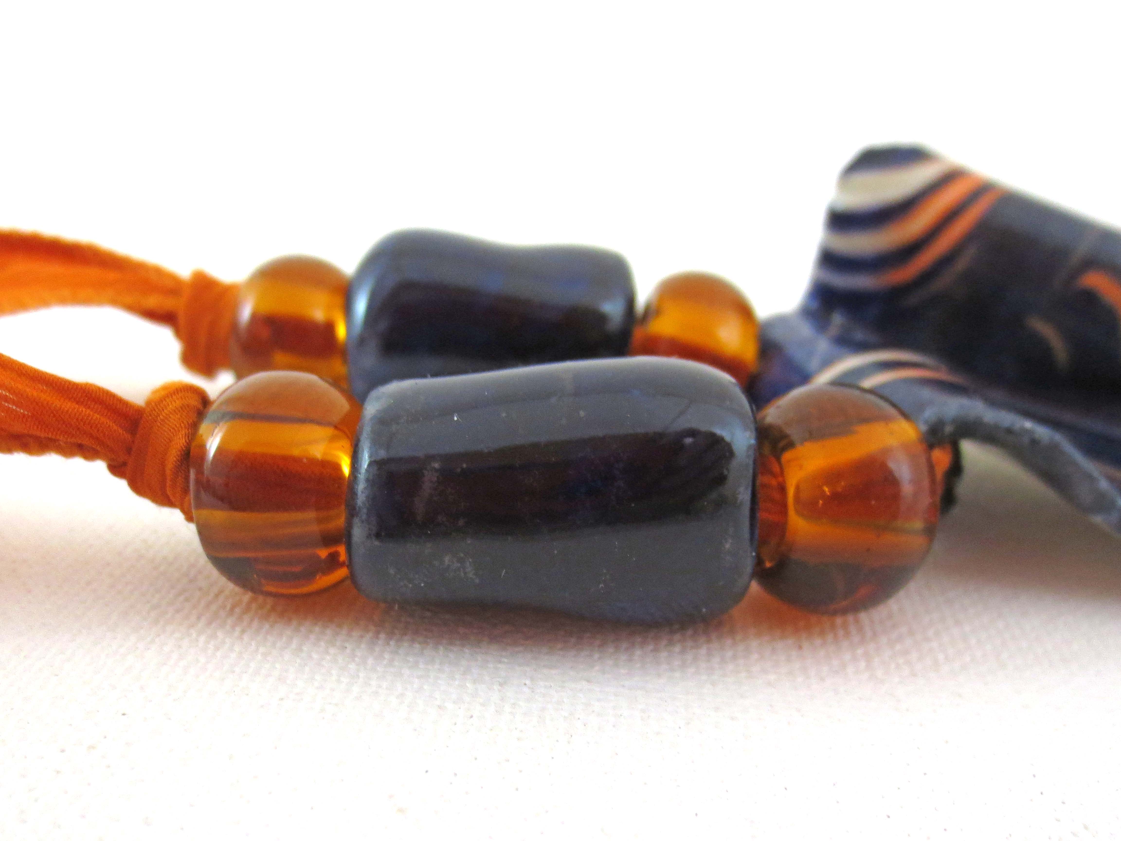 Close-up of orange & black ceramic