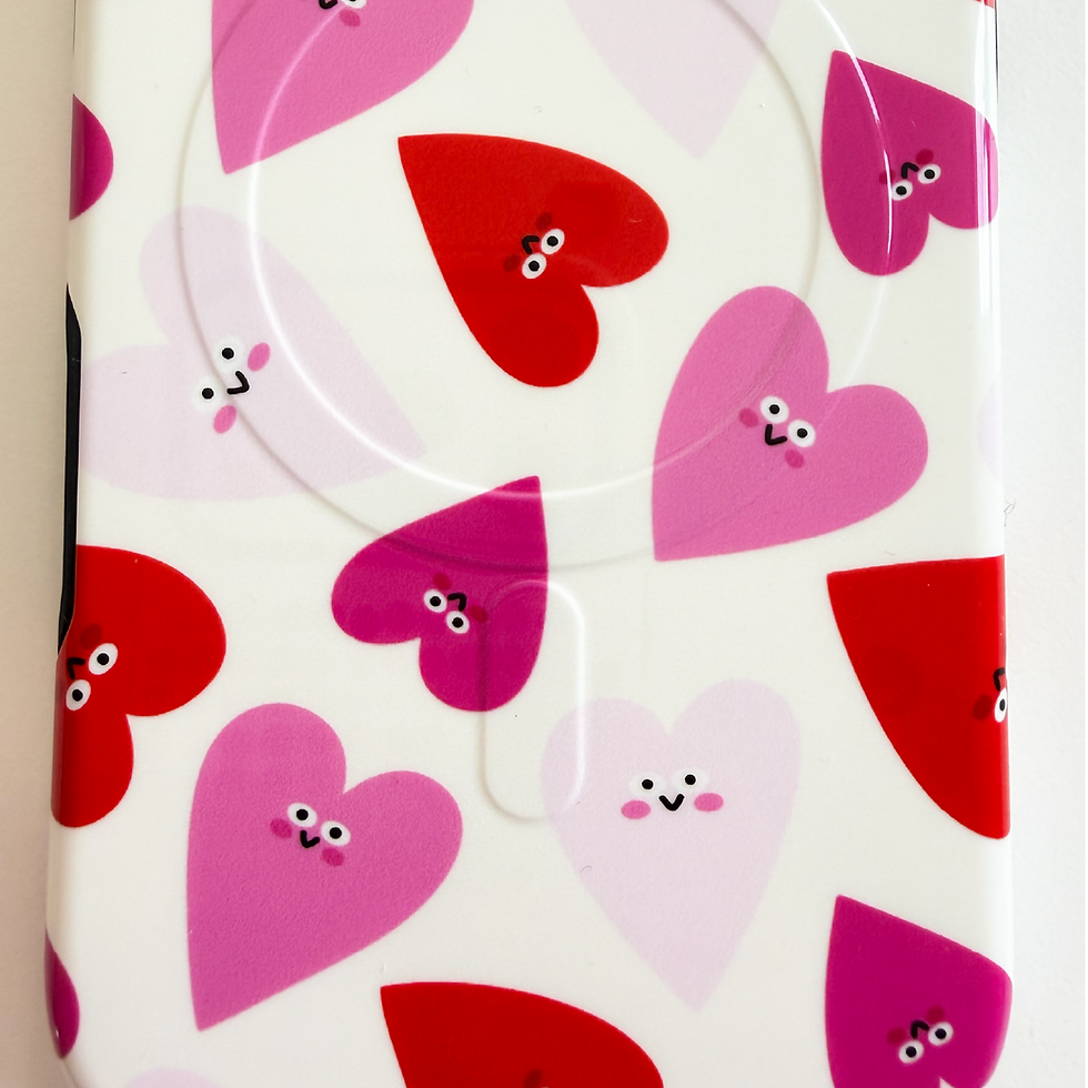 Close-up of pink and red happy hearts pattern printed on Boop It iPhone case