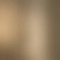 Close-up of contrasting luxury interior textures — rough travertine stone beside smooth bouclé fabric, warm natural light — Ironwood Solutions, Riyadh