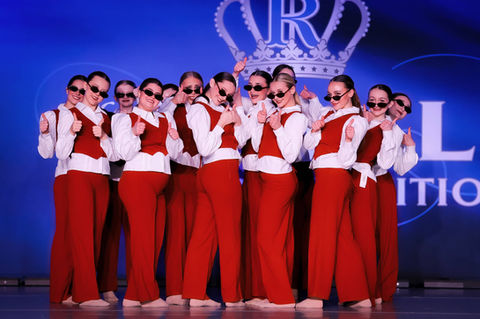 Group of young dancers celebrating at competition event