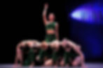 Group of young dancers celebrating at competition event