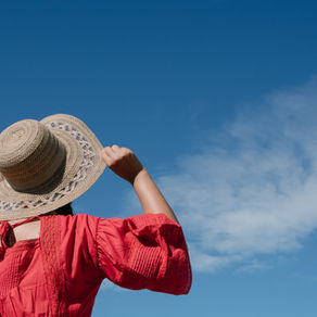 Japanese woman walking under the sun on summer day