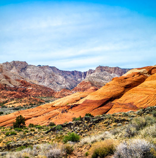 Mountain landscapes at Snow Canyon State Park featuring red rock cliffs and desert scenery near a luxury A-frame cabin stay in Southern Utah.