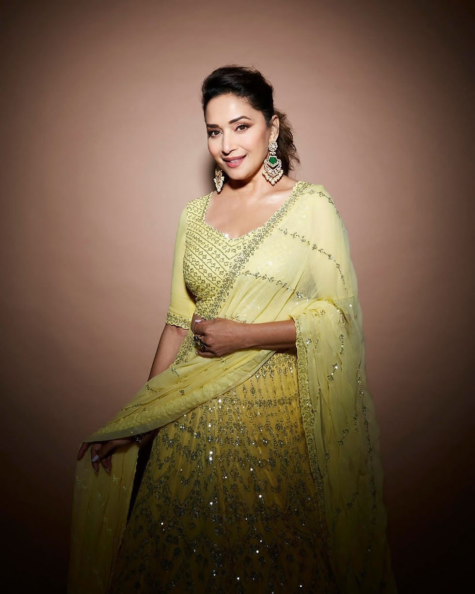This stunning bright yellow lehenga makes a chic case for summer ethnic wear and is proof of the label’s commitment to colour inclusion. Madhuri Dixit slayed in a beautiful Seema Gujral lehenga which featured intricate embroidery. The attire showcased a blouse with quarter sleeves and a V-neckline. Paired with a flared lehenga skirt and dupatta, it's a vibrant look we can all get behind. Summer and spring weddings are a delight and this design is ideal for those!
