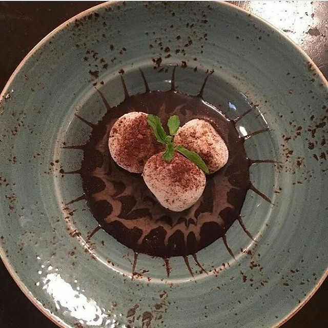 Amaretto Chocolate Rasgullas (soft milk dumpling on a bed of dark ghana chocolate and amaretto liqueur) 450/-