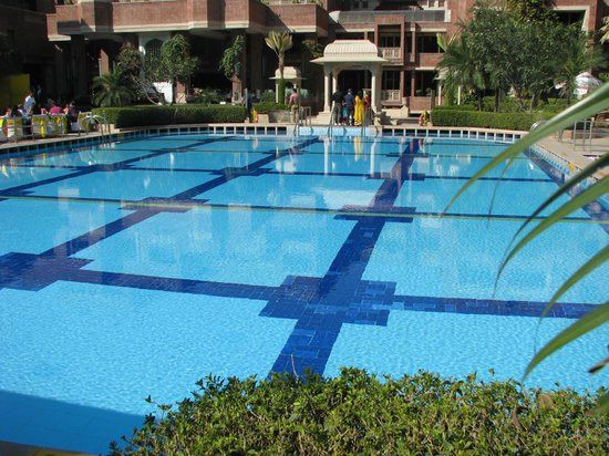 Swimming Pool: The hotel has a beautiful outdoor swimming pool that offers a perfect place for guests to relax and soak up the sun. The pool is surrounded by lush green gardens and provides a peaceful haven in the heart of the city.