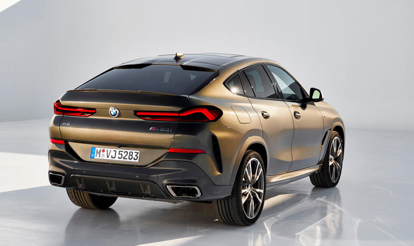 A hatch spoiler, elongated adaptive LED brake lights, a phony diffuser, and a dual-exit exhaust system are visible at the back
