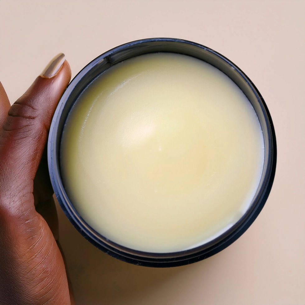 Close-up of Mane Beard and Hair Balm being held in hand, showing smooth, semi-solid texture.