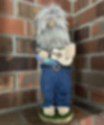 13" gray haired gnome playing his guitar