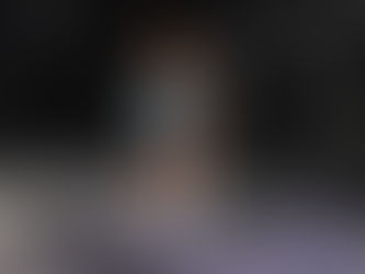 Confident female fitness coach in a gym setting, representing professional development in personal training and menopause support