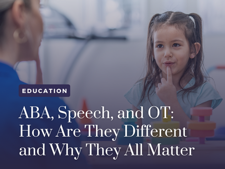 A woman helps a young girl through speech therapy.