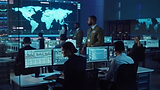 Firefly_US national security War Room. Many large monitors displaying cyber and national s