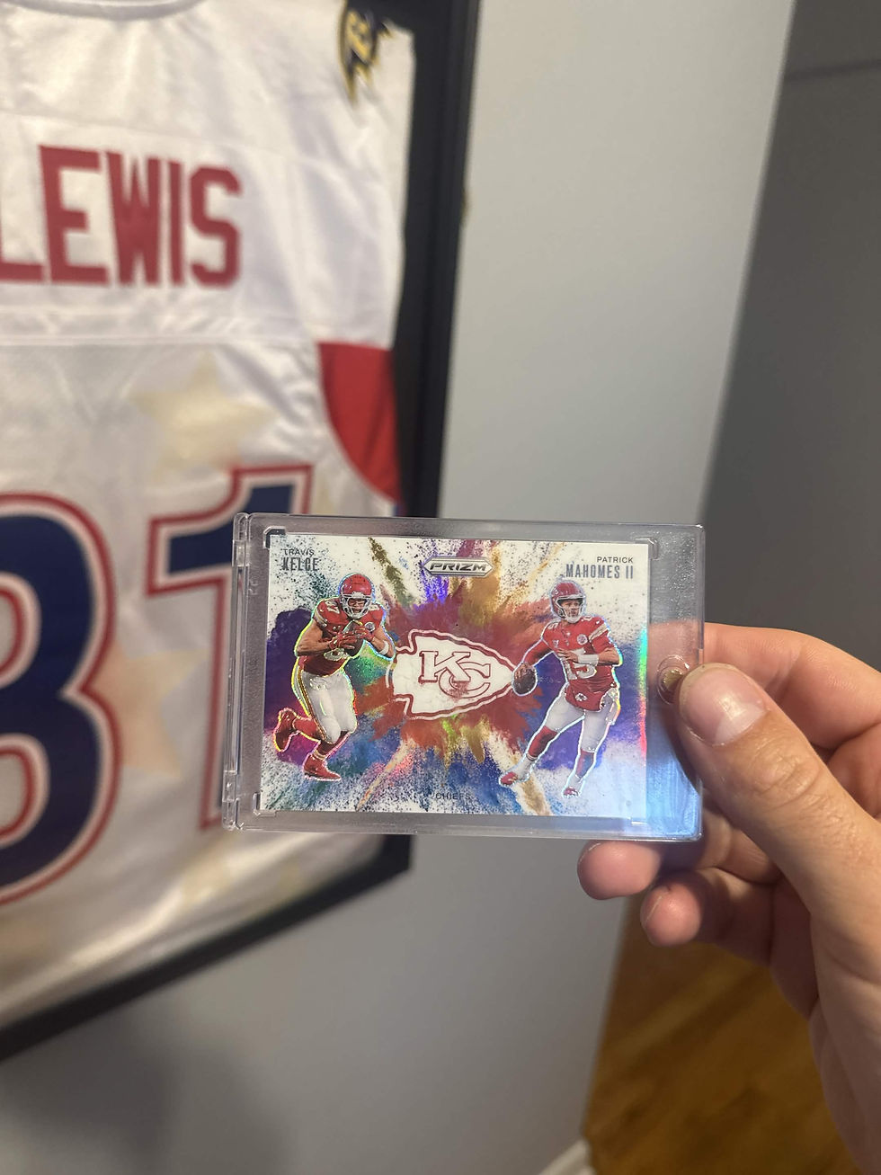 Hand holding a Patrick Mahomes and Travis Kelce football card