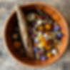 smudge stick and dried flowers in a bowl.jpg