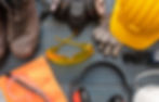 a man wearing Personal Protective Equipment, goggles, gloves and ear protection specifically.