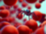 A small spider-like robot, floating in a stream of red blood cells