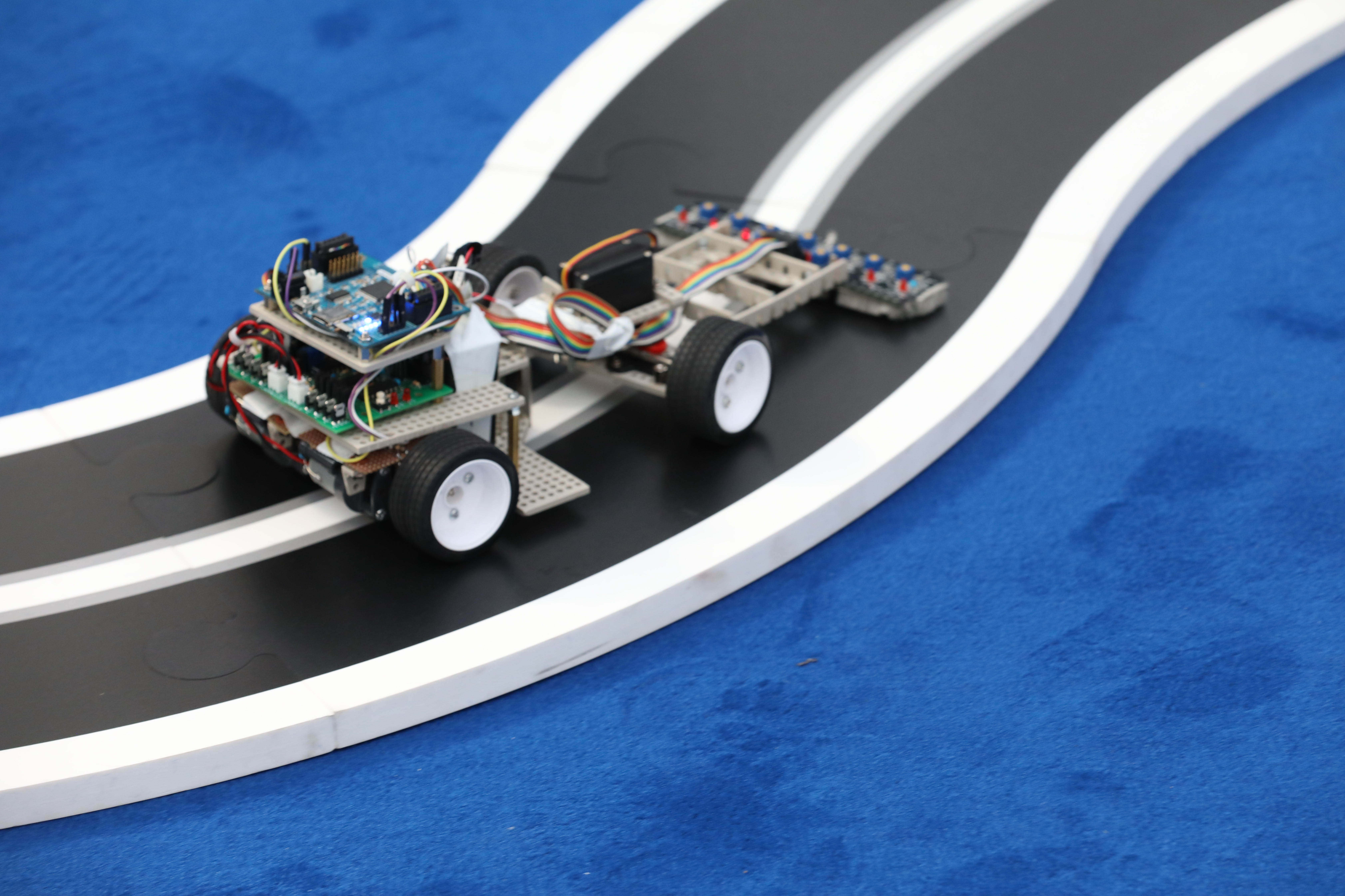The Renesas MCU rally car on the blue track