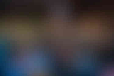 A room full of peopel sit and eat at STEW