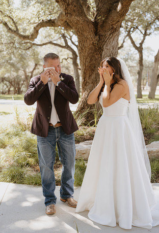 Emotional first look between the bride and her father before the wedding ceremony at The Chandelier of Gruene.