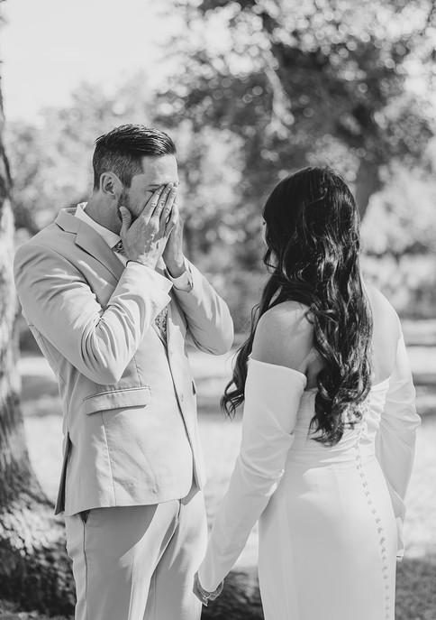Emotional moment as the groom tears up during their first look at The Addison Grove in Dripping Springs, Texas, captured by Grace J Photo, a Dripping Springs wedding photographer serving the Austin and Hill Country area.