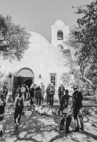 Candid moment of wedding guests laughing and celebrating at a Hill Country wedding near Fredericksburg