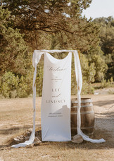 Wedding ceremony welcome sign displayed at The Waters Point in Wimberley, Texas