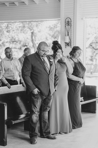 Emotional reaction from the groom's parents during the wedding ceremony at The Chandelier of Gruene.