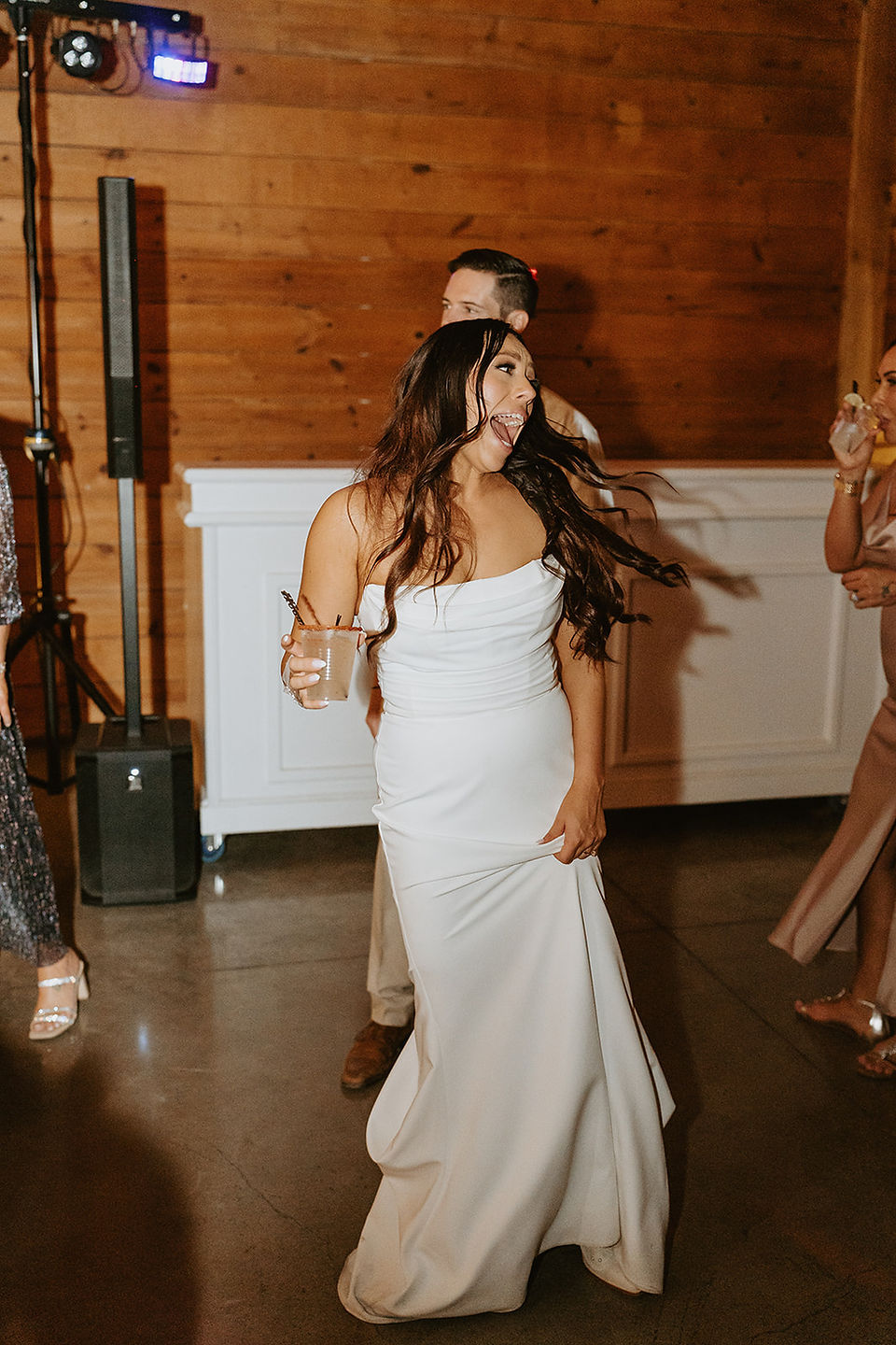 Bride dancing on the reception floor at The Addison Grove wedding venue in Dripping Springs, Texas, captured by Grace J Photo.