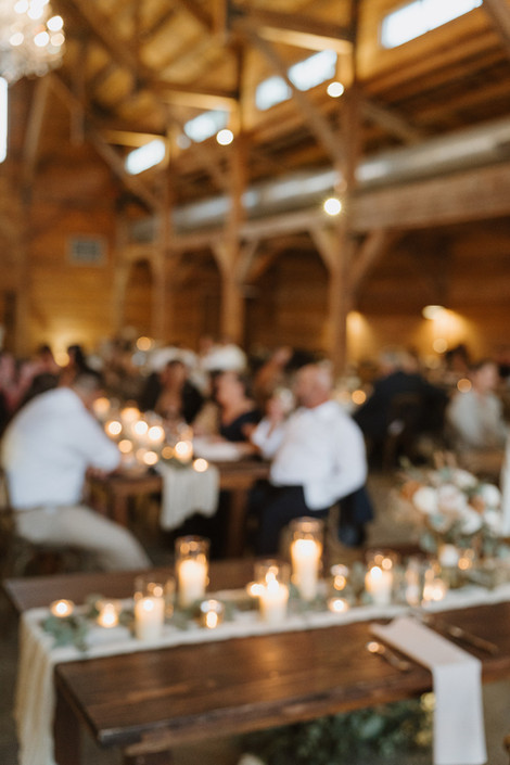 Wide view of the reception inside The Addison Grove barn during a Dripping Springs wedding, documented by Grace J Photo, serving Austin and the Hill Country.