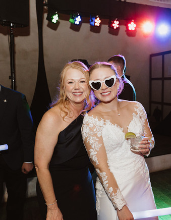 Guests dancing under warm lights at Lost Mission in the Texas Hill Country