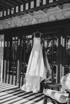 Bride’s wedding dress hanging before the ceremony at a private ranch wedding in the Texas Hill Country, Texas