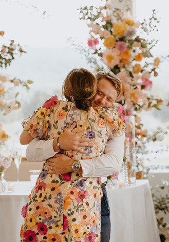 Groom hugging his mom during reception at Camp Hideaway in Fredericksburg, Texas