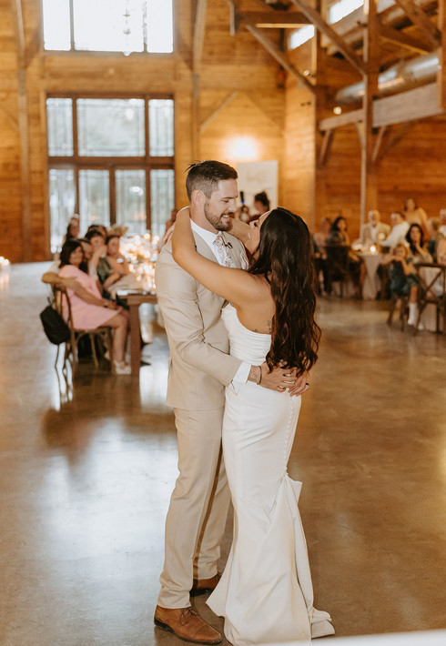 Bride and groom sharing their first dance at The Addison Grove wedding in Dripping Springs, Texas, photographed by Grace J Photo, a Dripping Springs wedding photographer.