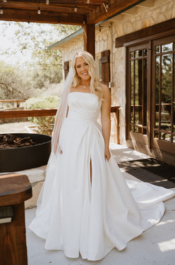 Bride smiling in her wedding dress during getting ready at a private ranch wedding in the Texas Hill Country, Texas