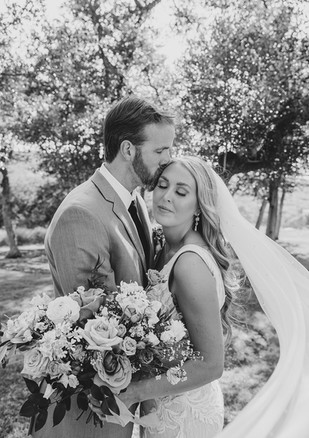 Black and white close-up portrait of bride and groom at Canyonwood Ridge Dripping Springs wedding