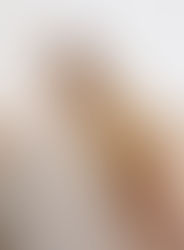 Glowing sunset portrait of bride and groom looking into each other’s eyes during their private ranch wedding in the Texas Hill Country, Texas