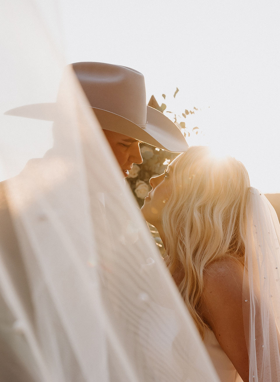 Bride and groom sharing an intimate golden hour moment at their private ranch wedding in the Texas Hill Country, Texas