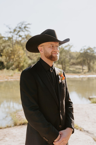 Groom’s emotional reaction as he sees his bride walking down the aisle at The Waters Point during their Wimberley wedding