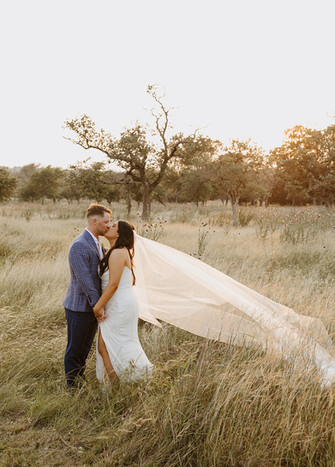 Bride and groom during sunset portrait at Camp Hideaway in Fredericksburg, Texas Hill Country wedding