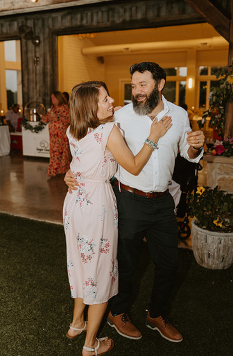 Guests dancing on the dance floor at Camp Hideaway in Fredericksburg, Texas Hill Country wedding