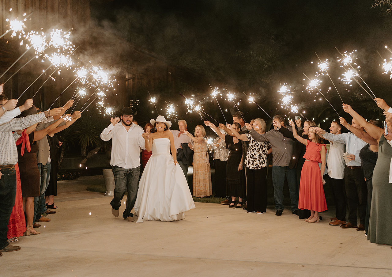 Bride and groom making their sparkler exit at The Chandelier of Gruene in Gruene, Texas.