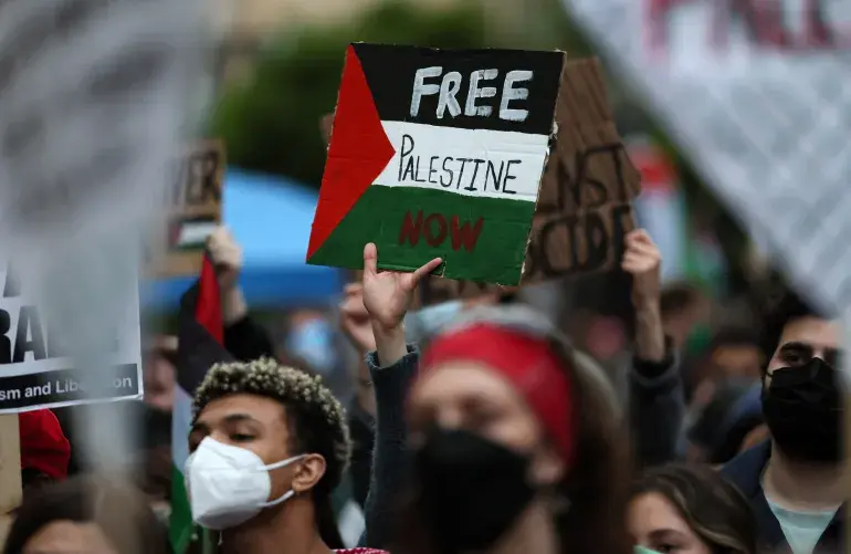 Students at a protest encampment demonstrate in support of Palestinians in Gaza at George Washington University in Washington, DC, on April 25, 2024 [Leah Millis/Reuters]