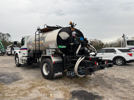 Paving Truck with Automatic Reverse Braking Systems
