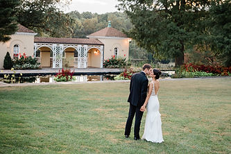 wedding-couple-kissing-belmont-manor-italian-structure.jpg