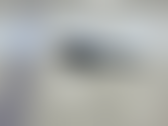 Why are ice rinks white? TLDR: Energy efficiency. 